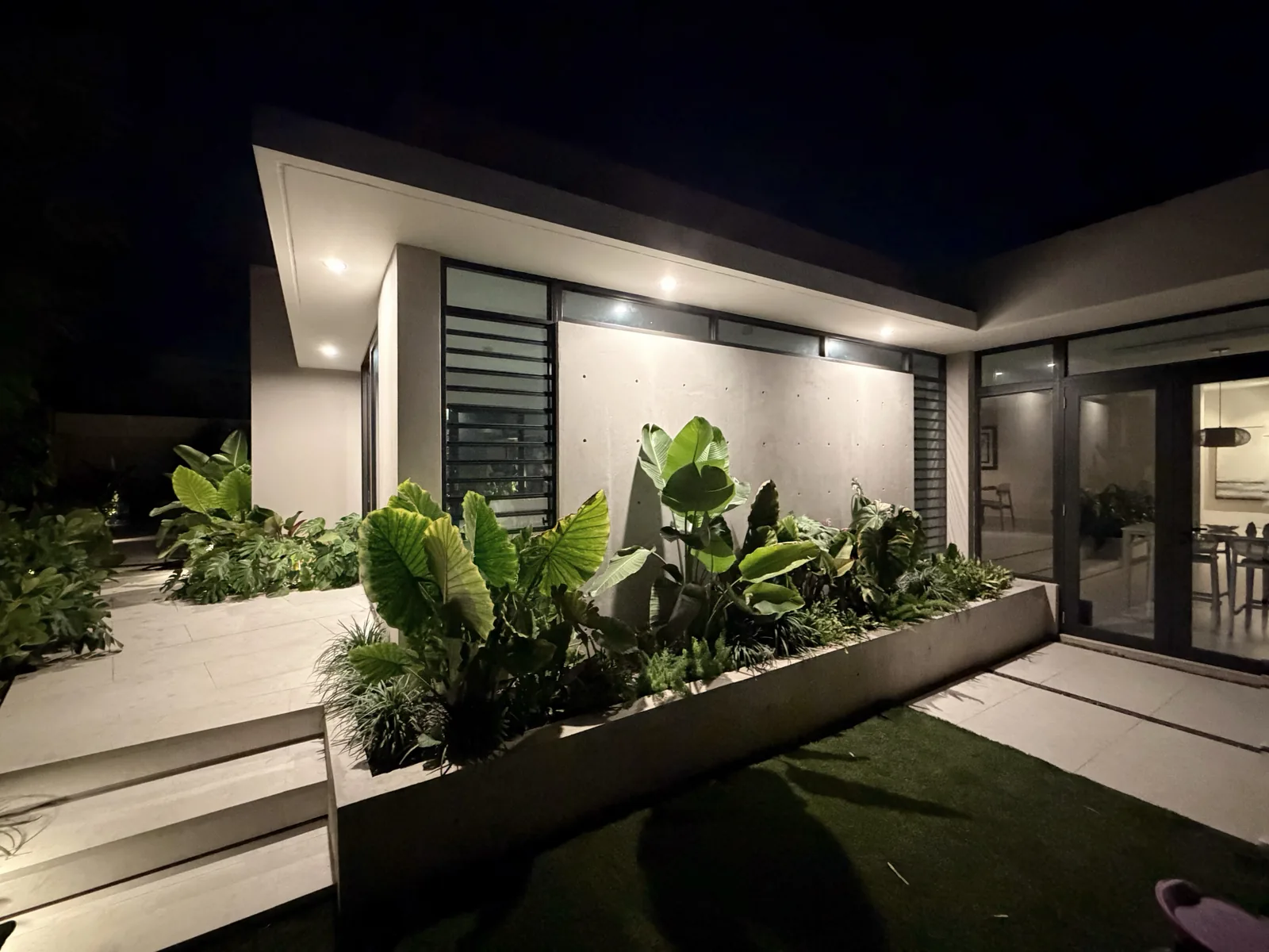 Paseo Real Addition — patio and entrance at night