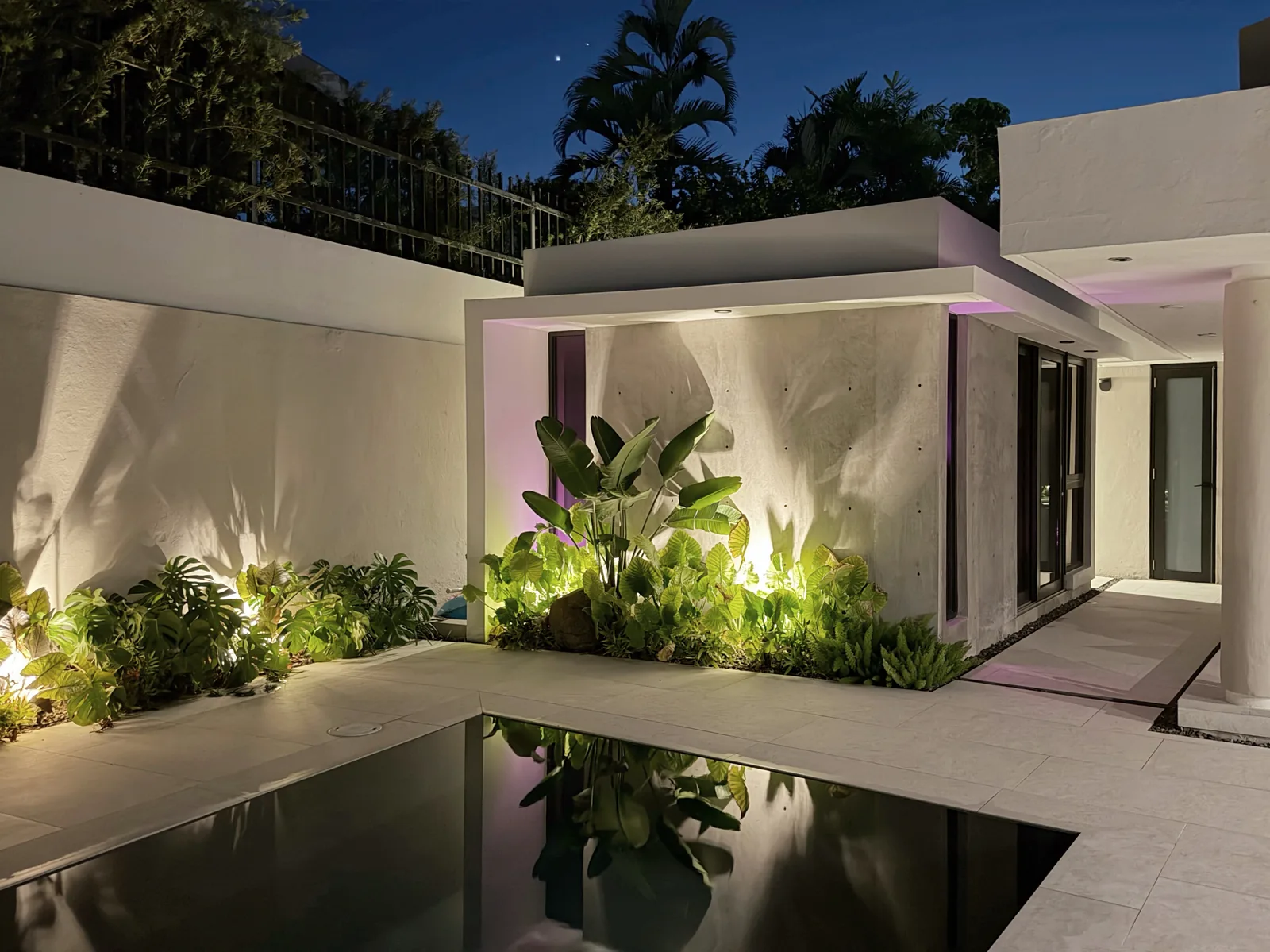 Paseo Real Addition — courtyard and pool at night