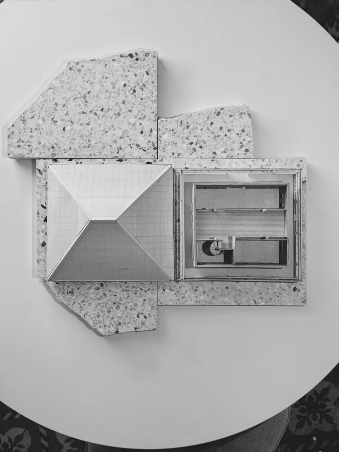 Múcaro Arquitectura — terrazzo material sample with inset study model